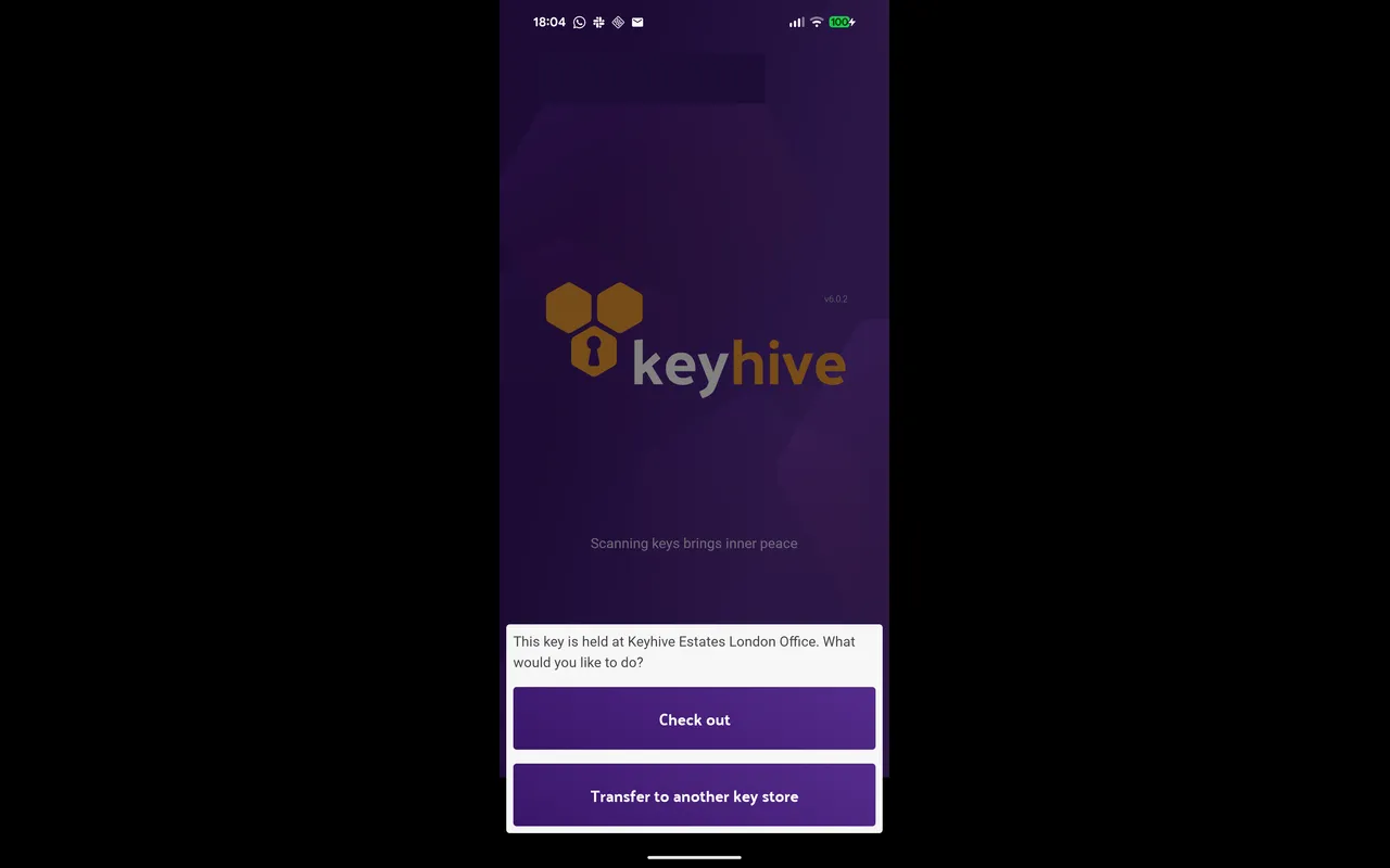 The mobile app asking whether to check the key out or transfer it to another key store